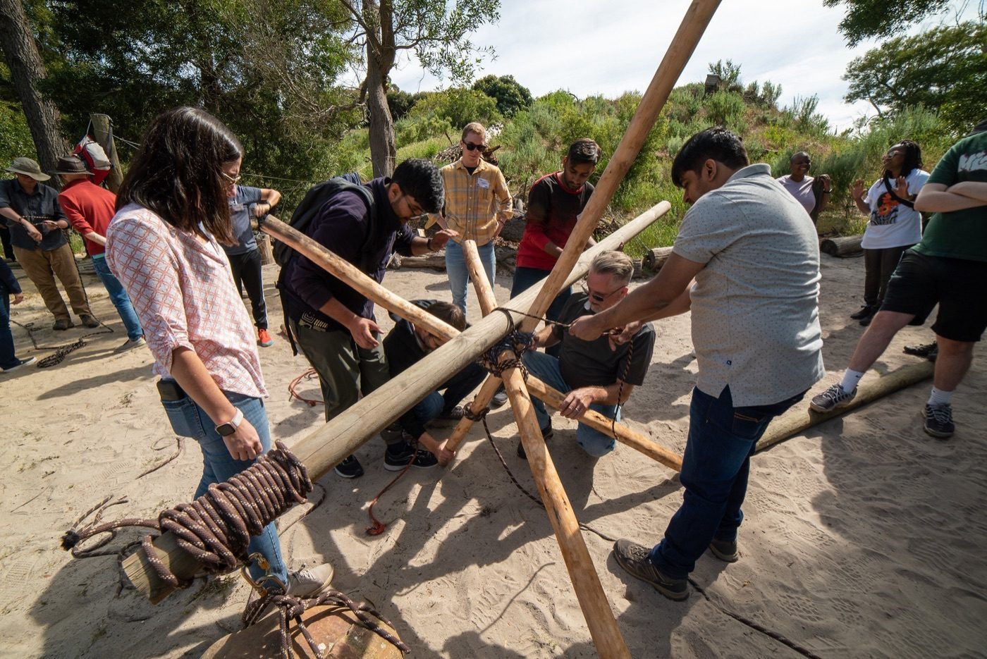 Dimagi colleagues building a structure together at a team offsite